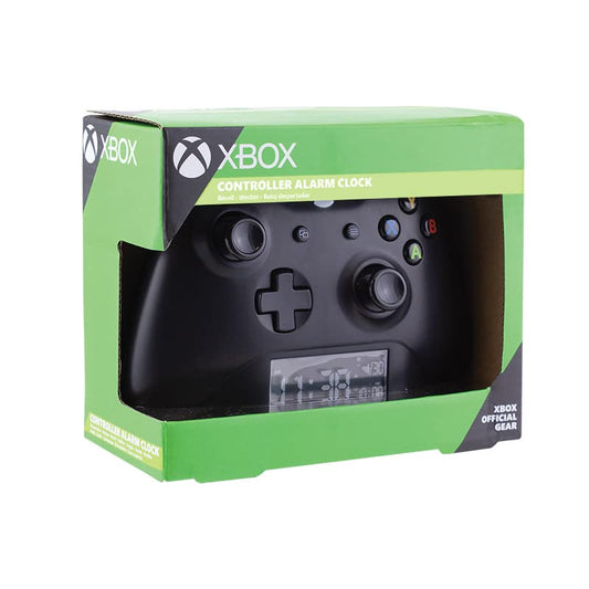Black Paladone Xbox controller alarm clock displaying time and date, official Microsoft licensed gaming bedroom decor.