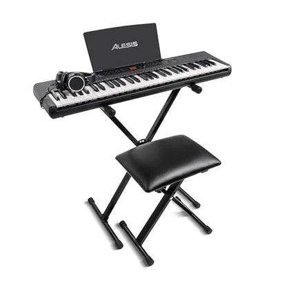 Alesis Melody 61 keyboard piano with 61 keys, built-in speakers, stand, bench, headphones, tablet stand, and colorful controls.