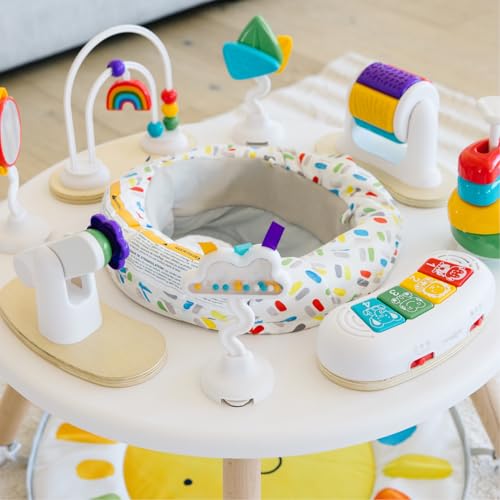 Move2Play 4-in-1 baby activity center with colorful toys, Montessori-inspired design, for tummy time, exersaucer, and jumper use.