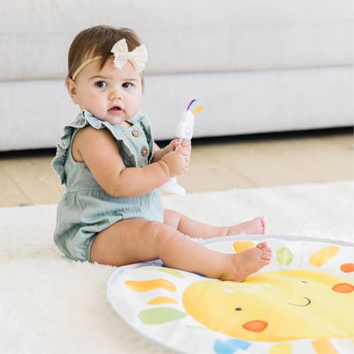 Move2Play 4-in-1 baby activity center with interactive toys, tummy time mat, exersaucer, and jumper for 3-6 months.