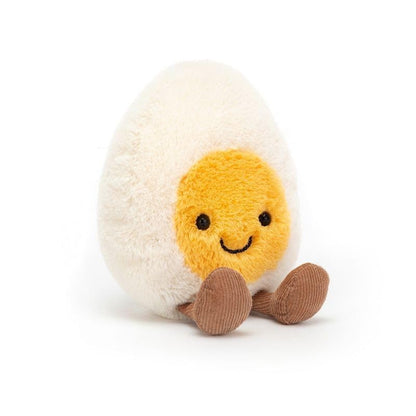 Jellycat Amuseable Happy Boiled Egg plush with a smiling face, measuring 4 cm x 8 cm x 14 cm, on a white background.