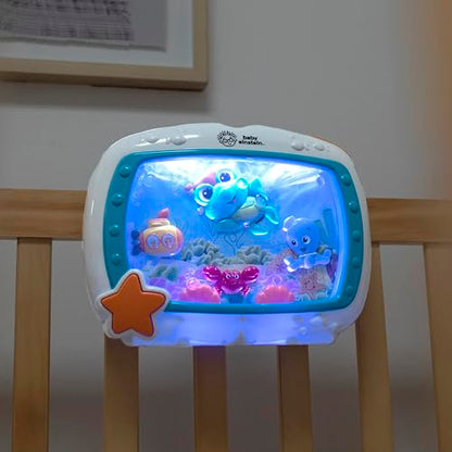 Baby Einstein Sea Dreams Soother crib toy with calming lights, melodies, and remote control for newborn sleep aid.