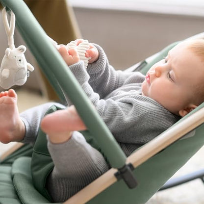 Maxi-Cosi Kori 2-in-1 baby bouncer chair with toy arch, adjustable recline, lightweight design, and newborn pillow in Beyond Graphite.