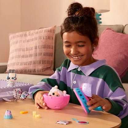 L.O.L. Surprise! Eye Spy Tots doll in blind packaging with color-change feature, fashion items, and accessories displayed.