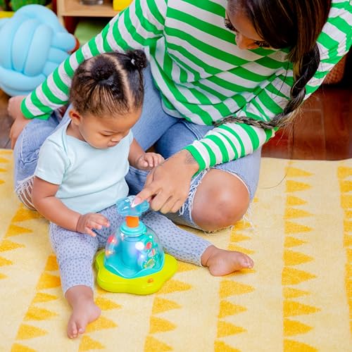 Bright Starts Press and Glow Spinner musical baby toy with multicoloured spinning parts for children aged 6 months and up.