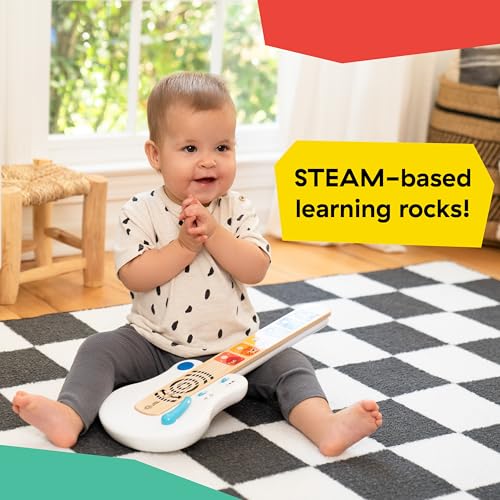 Baby Einstein Strum Along Songs wooden toy guitar with light-up buttons and whammy bar for babies 6 months and older.