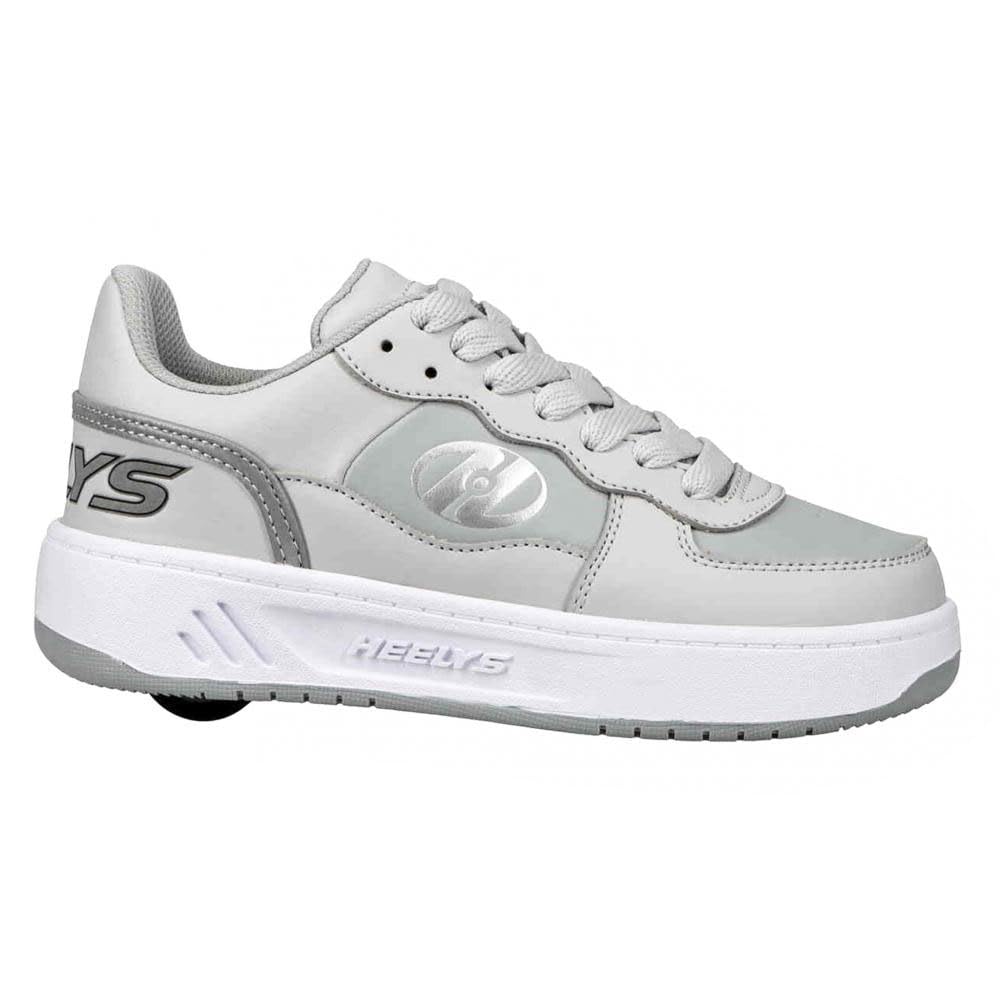Heelys girls Rezerve low-top sneakers in grey with white accents, featuring wheels in the heels for skateboarding fun.