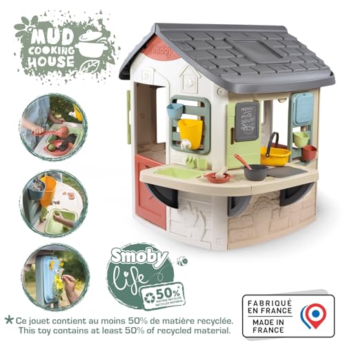 Smoby Life Mud Cooking House toy with colorful plastic structure, windows, and outdoor play area for children.