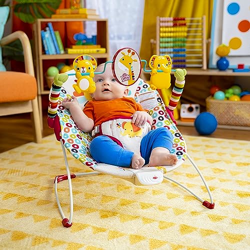 Bright Starts Playful Pinwheels Bouncer with colorful fabric and safety harness for infants, featuring playful pinwheel decorations.