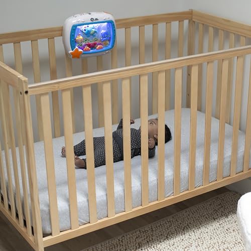 Baby Einstein Sea Dreams Soother crib toy with remote, calming lights and melodies for newborns and babies to promote sleep.