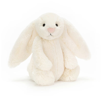 Cream Bashful Bunny plush toy by Jellycat, medium size, featuring soft fur and floppy ears, set against a neutral background.