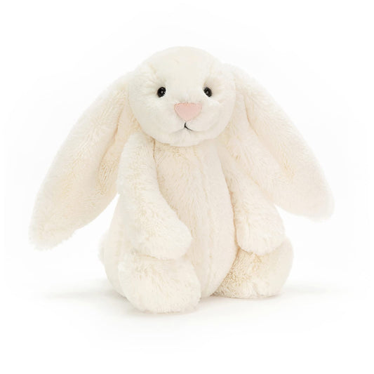 Cream Bashful Bunny plush toy by Jellycat, medium size, featuring soft fur and floppy ears, set against a neutral background.