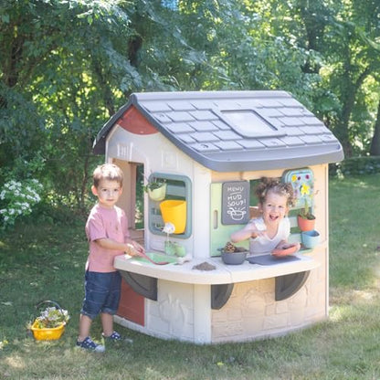 Smoby Life Mud Cooking House with play kitchen, utensils, and mud-themed accessories for outdoor imaginative play.