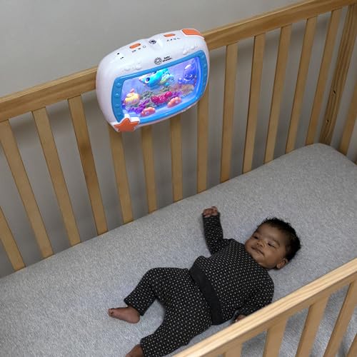 Baby Einstein Sea Dreams Soother with remote, featuring calming lights, melodies, and a crib toy for newborn sleep comfort.