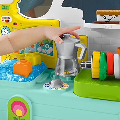 Fisher-Price Laugh & Learn 3-in-1 on-the-go camper toy for infants, featuring colorful musical push-along walker and activity centre.