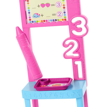 Barbie Teacher Doll with brunette hair, printed dress, toddler figure, and teaching accessories for educational play.