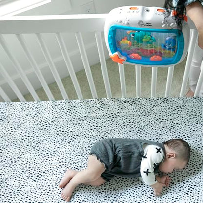 Baby Einstein Sea Dreams Soother crib toy with remote, calming lights, melodies, and sleep aid features for newborns and infants.