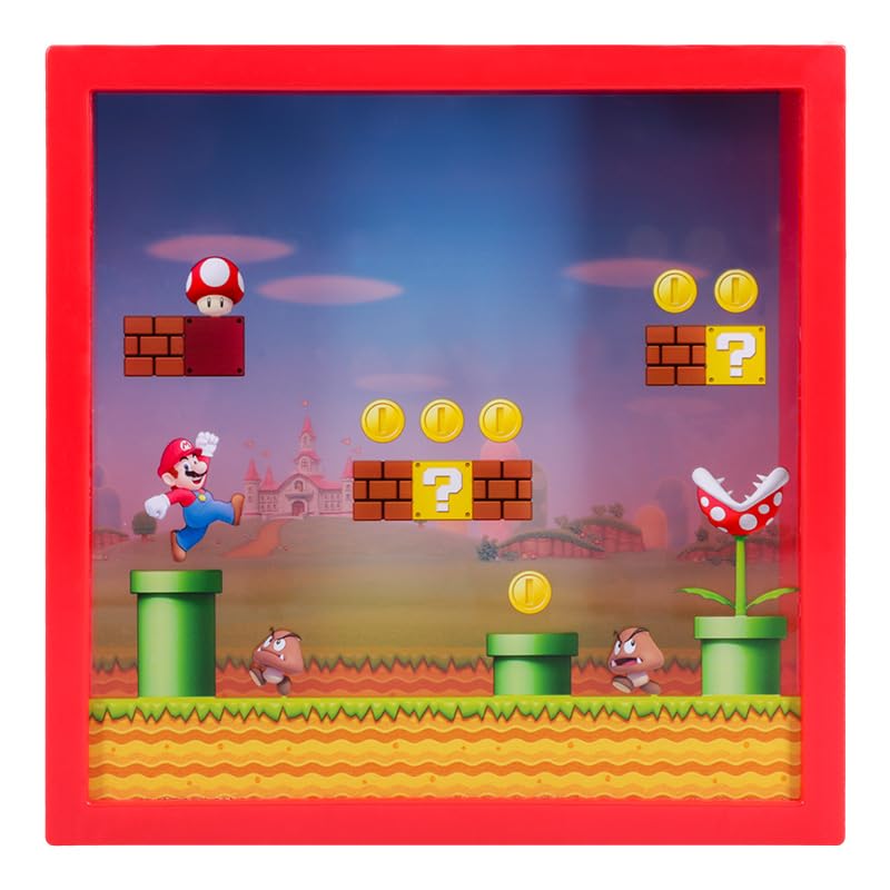 Super Mario money box by Paladone, officially licensed Nintendo piggy bank featuring Mario for savings and fan gifts, 18cm tall.