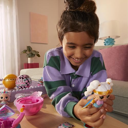 L.O.L. Surprise! Eye Spy Series Tots doll with blind packaging, color-change feature, fashions, and accessories displayed.