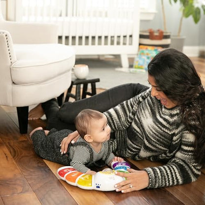 Baby Einstein Glow & Discover Light Bar musical activity station with colorful lights, buttons, and a plush toy for tummy time.