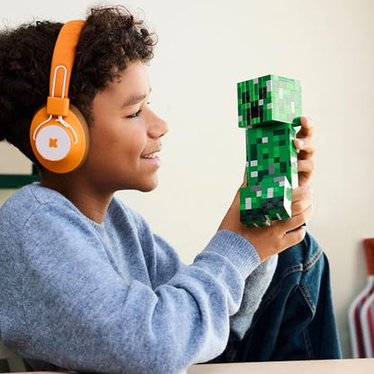 Posable LEGO Minecraft Creeper toy figure with hidden compartment, pig, and TNT element for kids 10 and up.