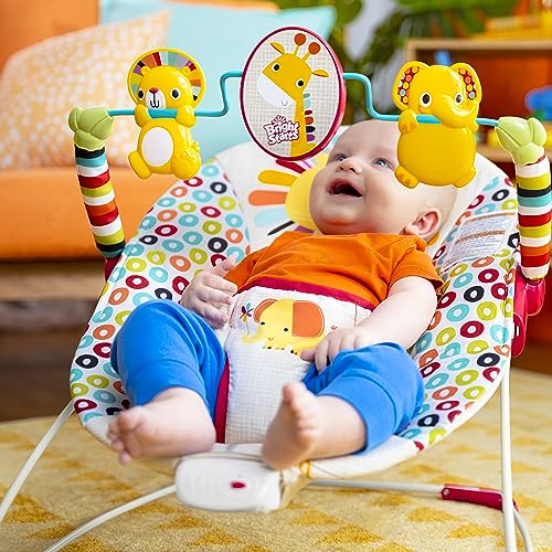 Bright Starts Playful Pinwheels Bouncer with colorful fabric and toy bar for infants, featuring a cozy padded seat and adjustable canopy.