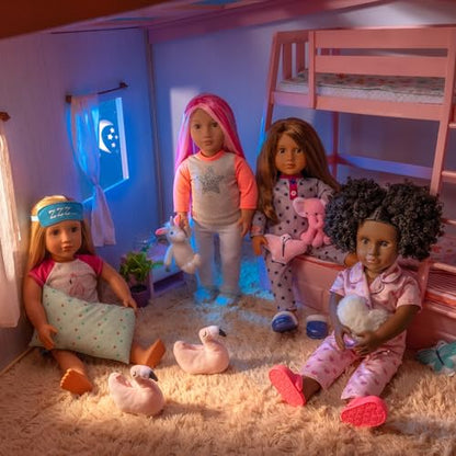 Our Generation Maria fashion doll in pyjama onesie holding an elephant plush toy, poseable doll with detailed features.