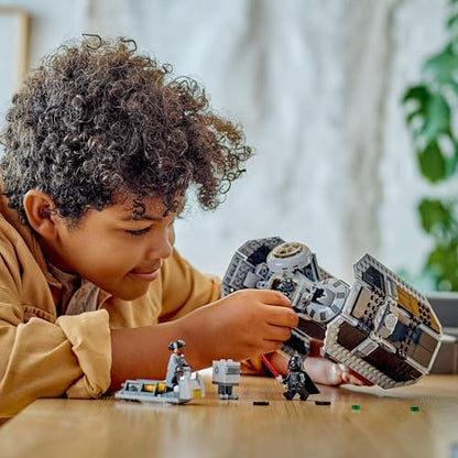 LEGO Star Wars 75347 TIE Bomber model with Gonk Droid and Darth Vader minifigure, showcasing torpedo-dropping feature.
