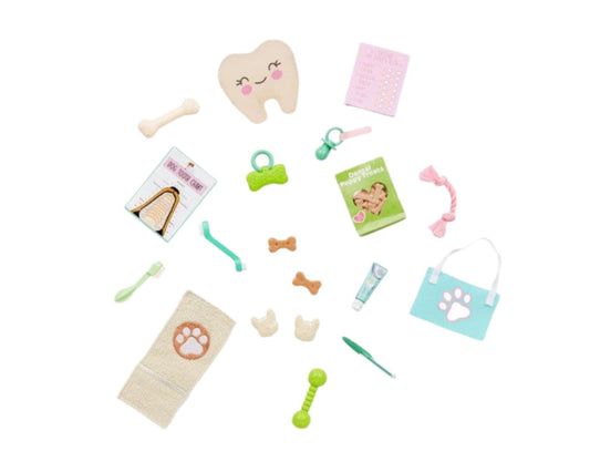 Our Generation 19-piece canine care dentist set for 18-inch dolls, featuring dental tools, chew toys, and treats.