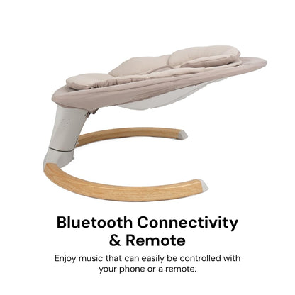 DreamX E-Swing baby swing in Dune with pebble grey accents, featuring Bluetooth, remote control, and 5 speed settings.