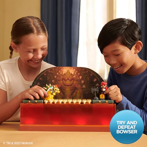 Super Mario Deluxe Bowser Battle Playset with lights and sounds, including 2.5-inch Bowser action figure for kids aged 3+.