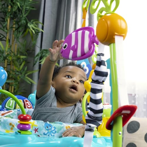 Baby Einstein Ocean Explorers Curiosity Cove 2-in-1 activity jumper and floor toy for babies 6-12 months, featuring colorful ocean-themed toys.