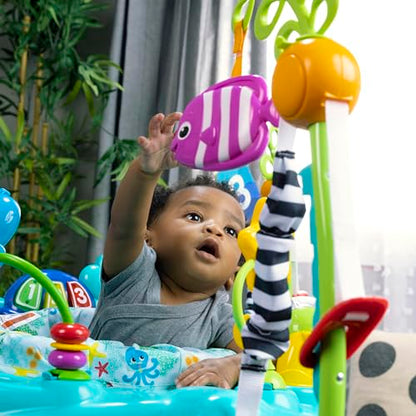 Baby Einstein Ocean Explorers Curiosity Cove 2-in-1 activity jumper and floor toy for babies 6-12 months, featuring colorful ocean-themed toys.
