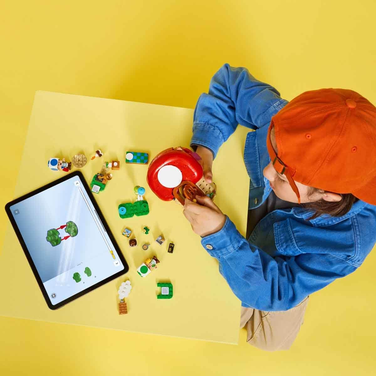 LEGO Super Mario Party at Toad's House set with Mario and Toad figures, kitchen, bedroom, and picnic table scene for kids.