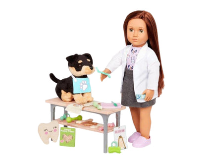Our Generation canine care dentist set with dental tools, chew toys, and treats for 18-inch dolls in a playful vet scene.