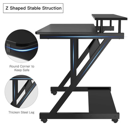 Black Dripex computer desk with monitor shelf, mobile wheels, storage shelves, compact Z shape, ideal for small home office spaces.