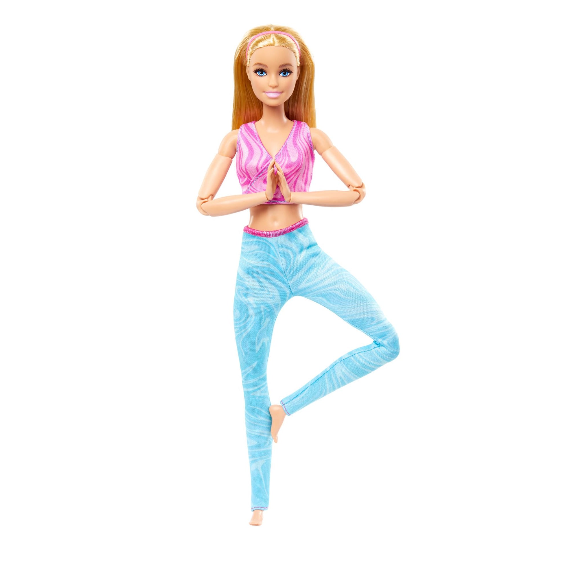 Barbie Made to Move doll with blonde hair in pink sports top and blue yoga pants, showcasing 22 bendable joints.