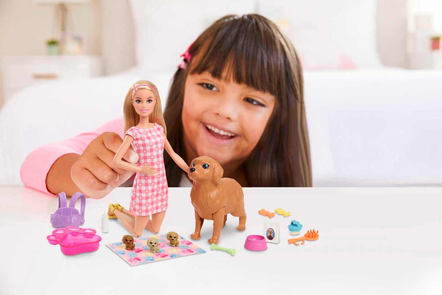 Barbie blonde doll playset with mommy dog, three puppies, and 11 accessories in a colorful scene.