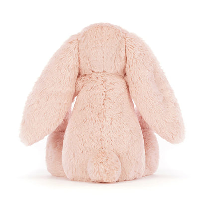 Bashful Blush Bunny plush toy by Jellycat, featuring soft fur and floppy ears, sitting on a white background.