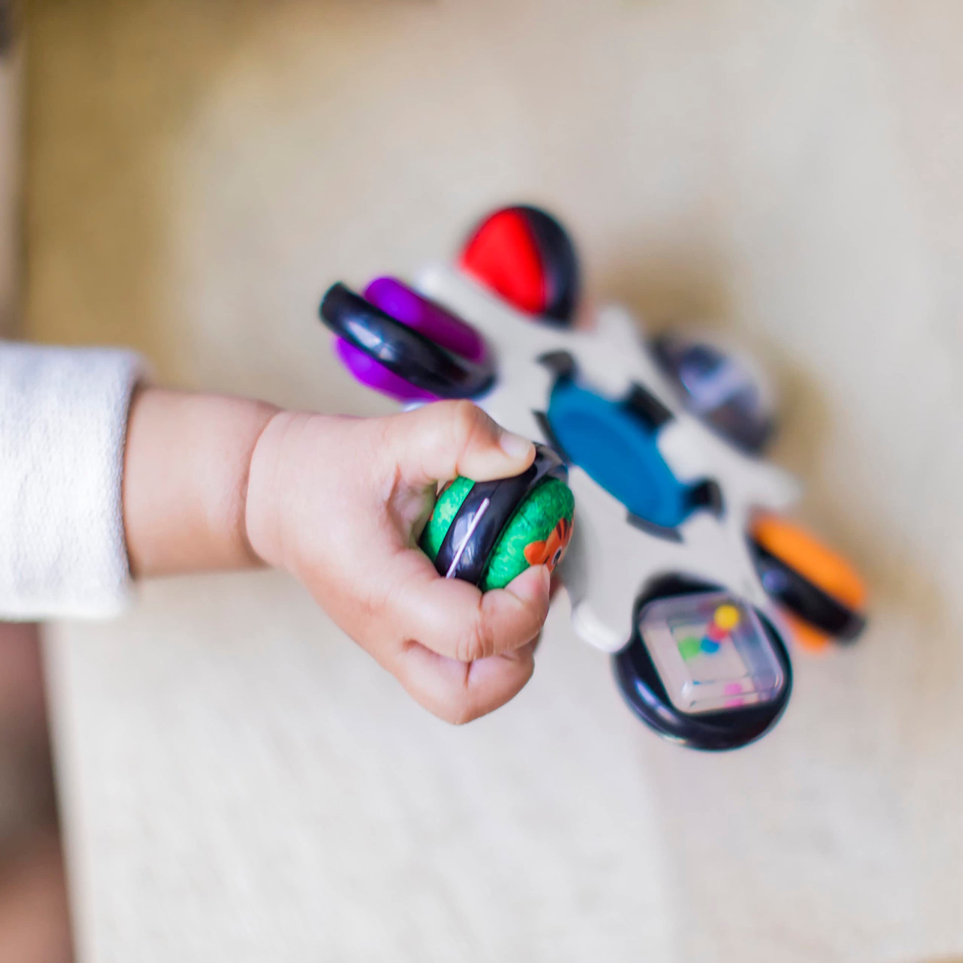 Baby Einstein Baby Curiosity Clutch Fidget Toy with Pop It Rattle, BPA-free infant teether for ages 3 months and up.