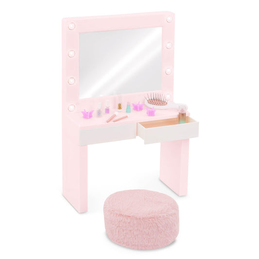 Our Generation pink vanity table playset with light-up mirror and pretend makeup accessories for 18-inch dolls.