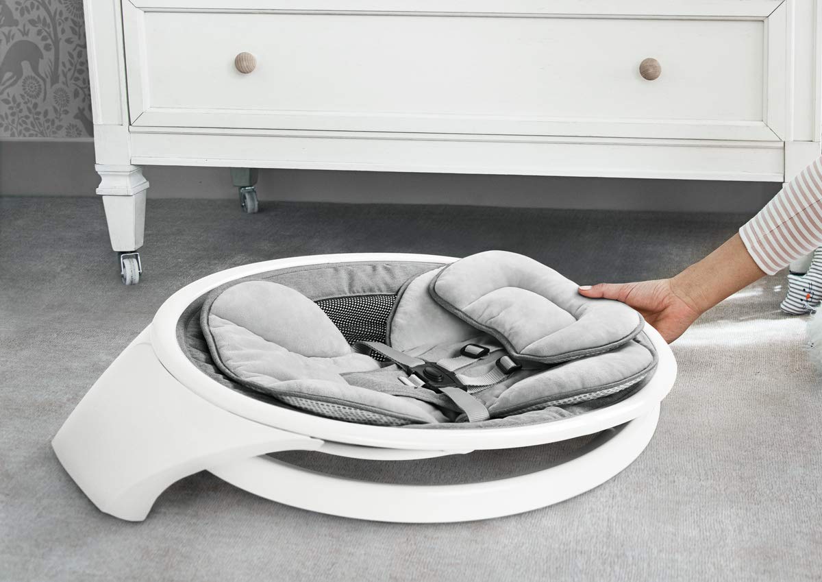 Munchkin electric baby swing in white with Bluetooth, portable rocker with gentle bouncing, motion, and sound features for infants.