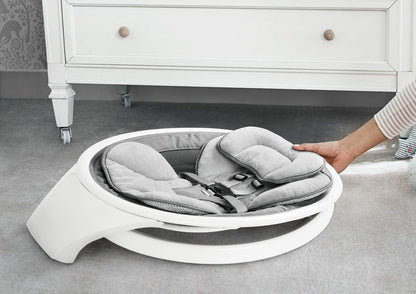 Munchkin electric baby swing in white with Bluetooth, portable rocker with gentle bouncing, motion, and sound features for infants.