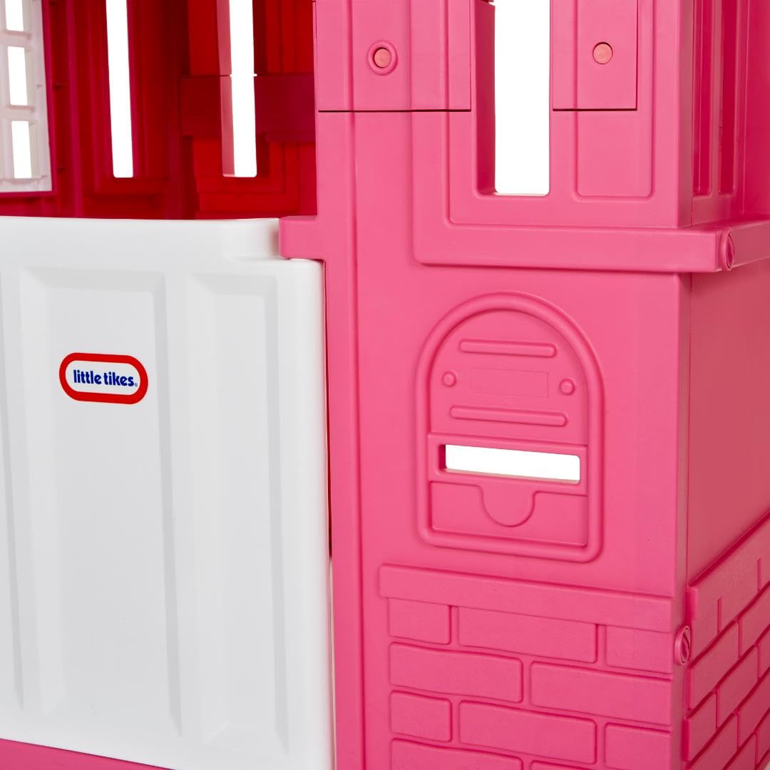 Pink Little Tikes Cape Cottage princess playhouse with working doors, windows, and shutters for kids' imaginative outdoor fun.