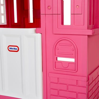Pink Little Tikes Cape Cottage princess playhouse with working doors, windows, and shutters for kids' imaginative outdoor fun.