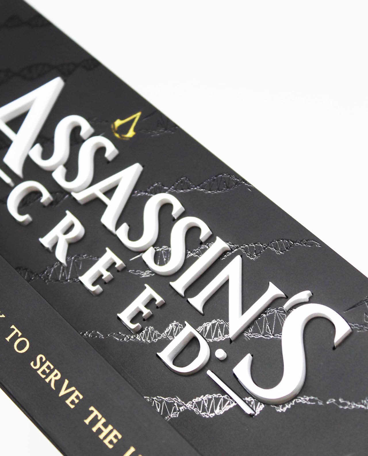 Neamedia Assassin's Creed logo LED lamp on a living room table, compatible with gaming consoles and mobile devices, official licensed product.