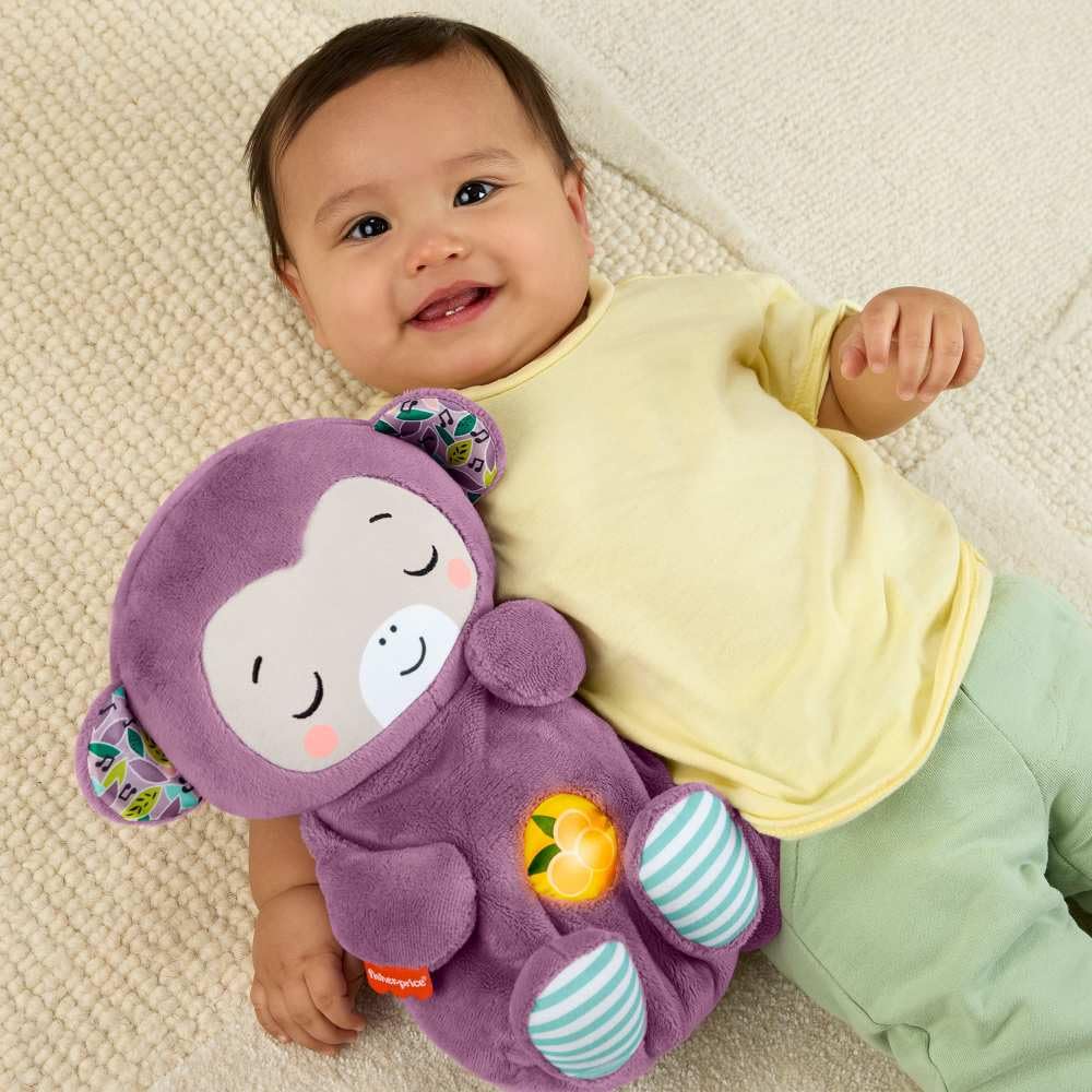Fisher-Price Baby Soothe ‘n Snuggle Purple Monkey plush toy with built-in sound machine, lights, and breathing motion for newborns.