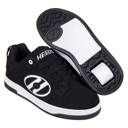 Heelys Voyager tennis shoe in black and white for big kids, featuring wheels in the heel for casual skating and walking.