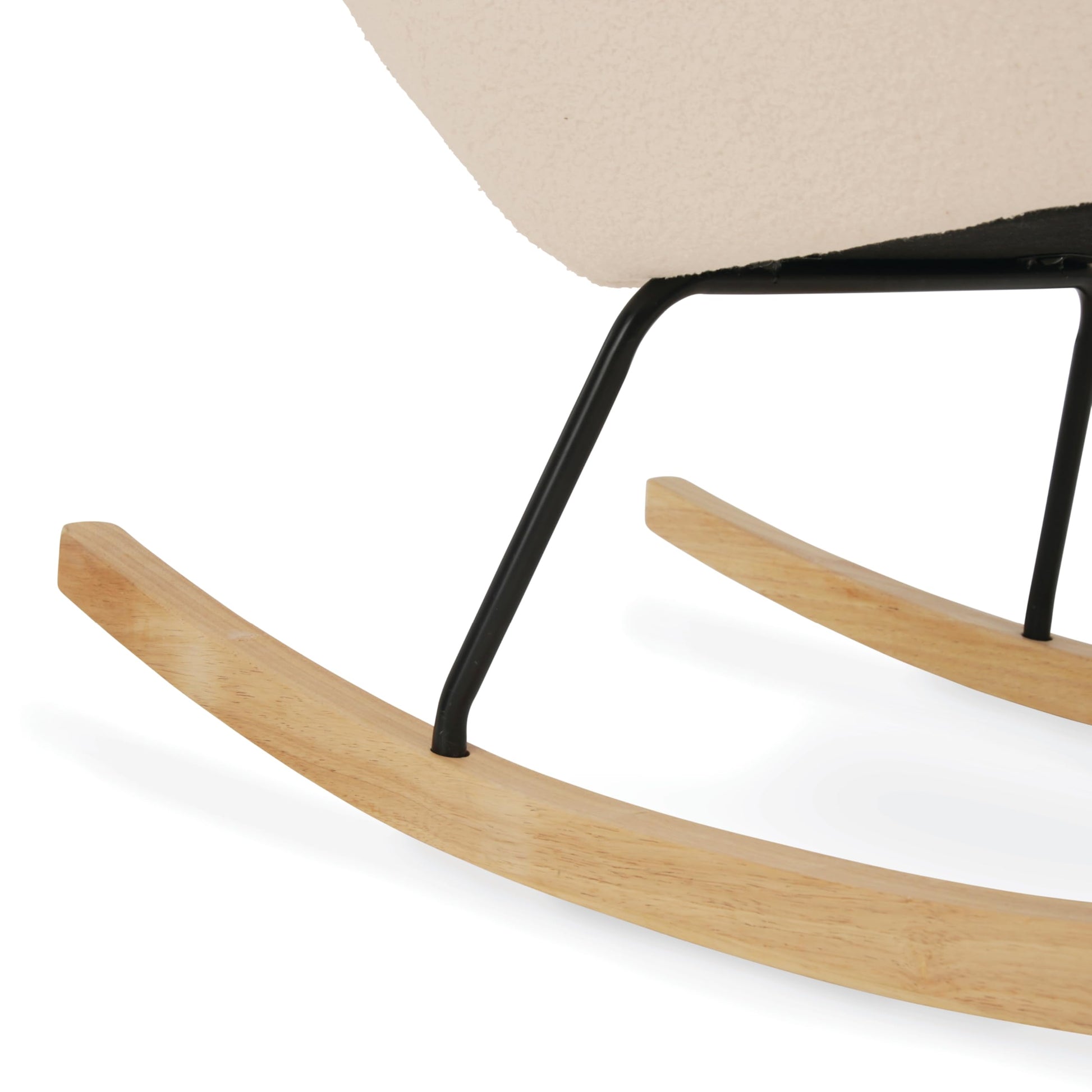 Light beige CuddleCo Marley nursing chair and footstool in a nursery, featuring a comfortable rocking and glider armchair for breastfeeding moms.
