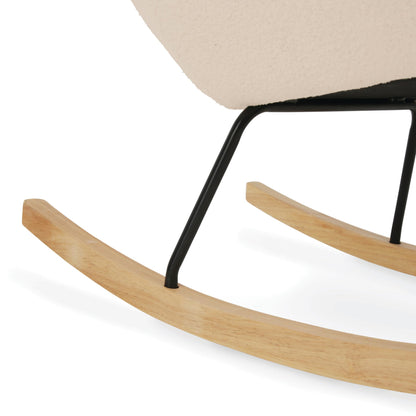 Light beige CuddleCo Marley nursing chair and footstool in a nursery, featuring a comfortable rocking and glider armchair for breastfeeding moms.
